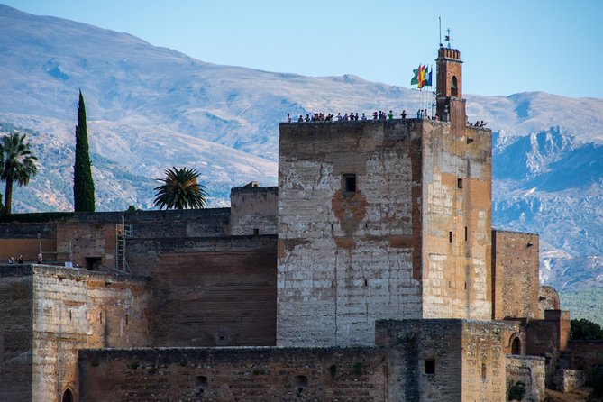 Alhambra and Nasrid Palaces Ticket with Audioguide - Collecting your ticket near the Hotel Guadalupe