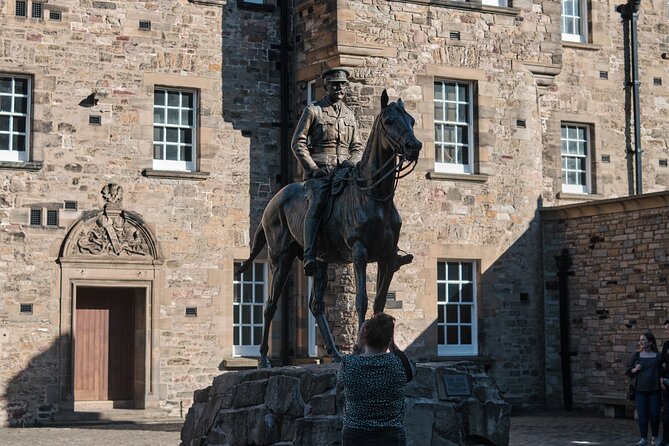 Edinburgh Castle Guided Walking Tour & Holyrood Palace Ticket - Edinburgh Castle and the drama of Castle Rock