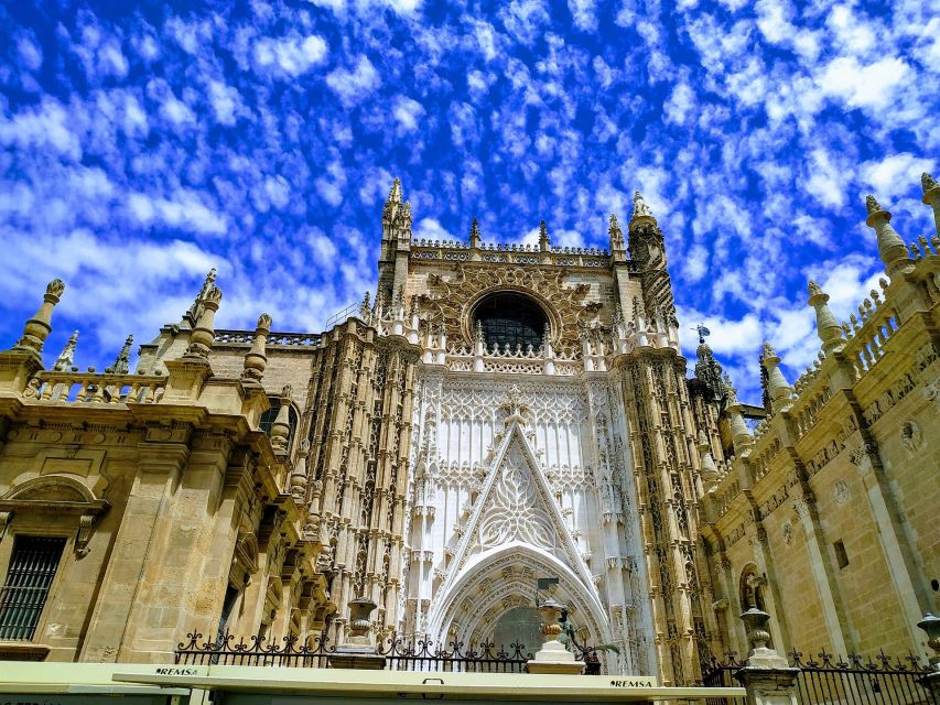 From Costa del Sol: Seville and Royal Alcázar Palace - Walking Through Barrio de Santa Cruz