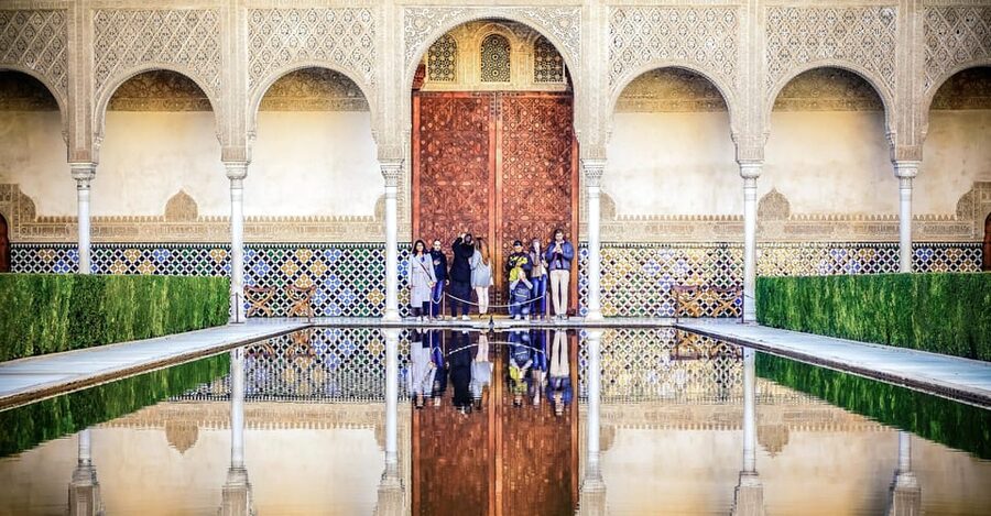 Granada: Alhambra & Nasrid Palaces Small Group Guided Tour - Entering through the Alhambra complex