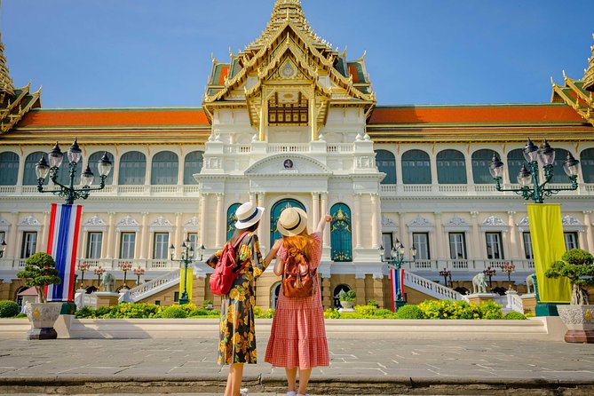 Grand Palace, Damnoen Floating Market & Maeklong Railway Market Tour – Full Day - Maeklong Railway Market and the umbrella-pull moment
