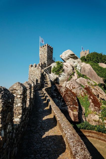 Lisbon: Pena Palace, Sintra, Cabo da Roca, & Cascais Tour - Pena Palace and its colorful hilltop setting