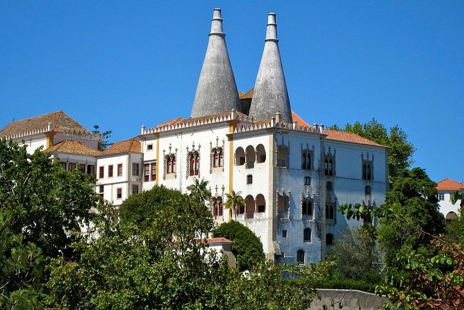 Sintra, Pena Palace, Quinta da Regaleira & Cascais Group Tour - Estoril on the return drive